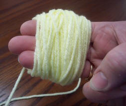 wrap yarn to make a yarn pompom